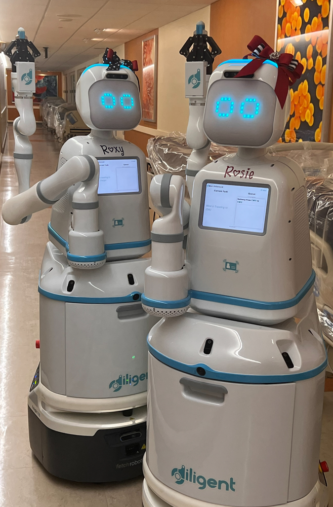 Two robot assistants at Lancaster General Health, labeled Roxy and Rosie.